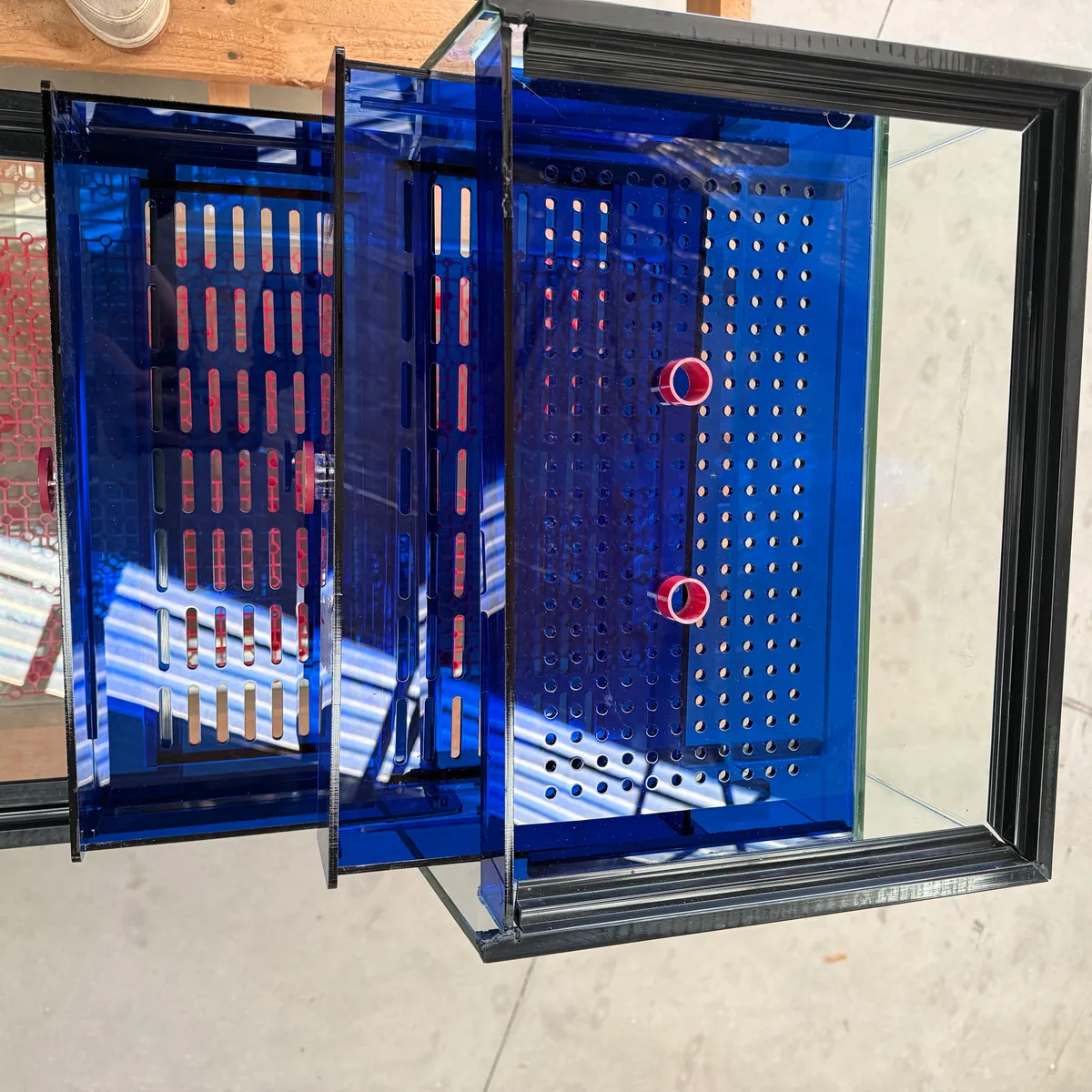 Low-iron glass panels cut and bonded on the workshop bench